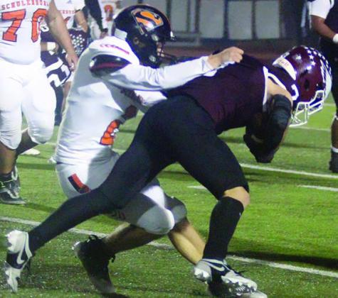 John Davis makes a fourth-down tackle in the fourth quarter Sticker Photo By Darrell Vyvjala
