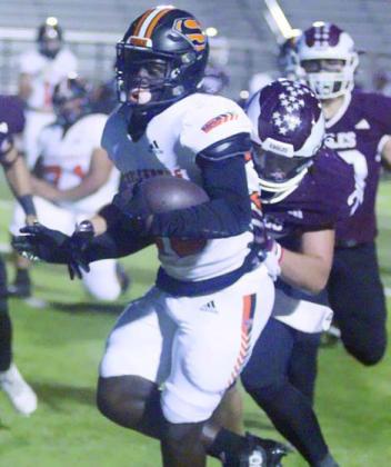 Rodney H Walton scores on a second-quarter run. Sticker Photo By Darrell Vyvjala