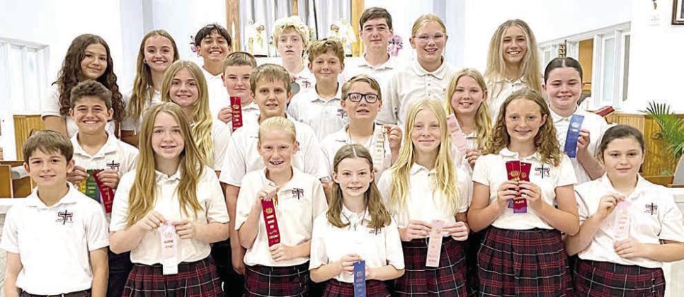 Grades 5-8 Winners – (front row, from left) Dillon Goedrich, Reese Dusek, Briley Hartensteiner, Rylee Wright, Brynn Bubela, Caroline Bartek, Kaylee Berger, (middle row) Cal Schiffli, Mallory Bonner, Abraham McBride, Levi Johnson, William Herzik, Patrick Taylor, Brynlee Berger, Charlotte Schmidt, (back row) Anna Oeding, Miranda Bonner, Maximo Hernandez, Allen Ballard, Will Taylor, Ashtyn Schaefer and Jenna Guentert.