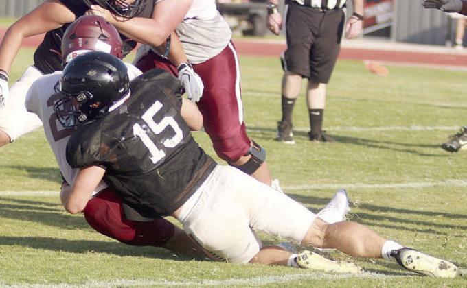 Preston Kahn drags down an Indian running back for no gain. Sticker Photo By Darrell Vyvjala
