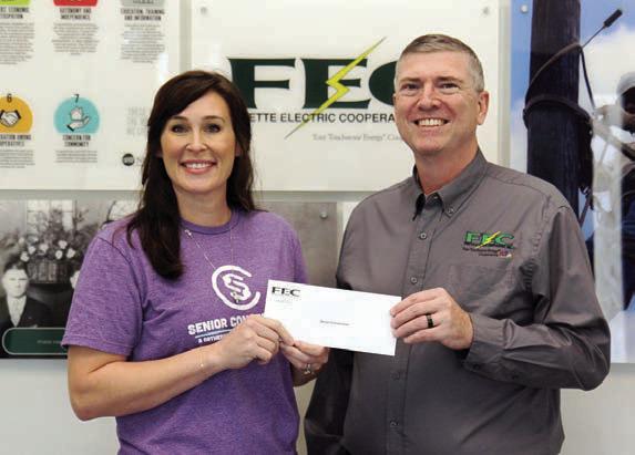 Fayette Electric Cooperative members donated funds to Senior Connections as the result of funds collected during Document Shred Day. Shown are (from left) Senior Connections executive director Amanda Kridel and Fayette Electric Cooperative General Manager Doug Lambert.