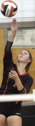 Landry Zapalac serves one of her three aces Friday. Sticker Photo By Darrell Vyvjala