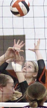 Madison Kunschick gets to a deflected Ganado spike. Sticker Photo By Darrell Vyvjala