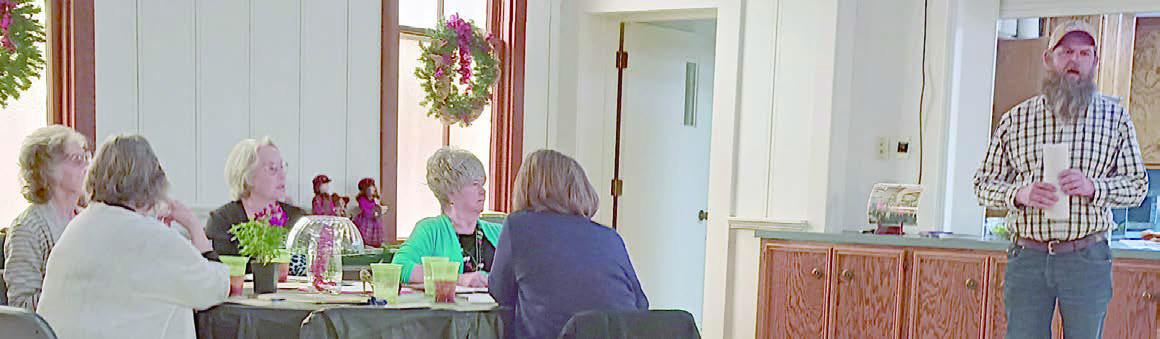 Guest speaker Andy Behlen (right) discussed various aspects of gardening and growing plants. Club officers seated at the table listening to the program were (back, from left) Wanda Brown, Nancy Tinsley, Bonnie Baker, (front) Carolyn Neely and Shirley Winkelman.