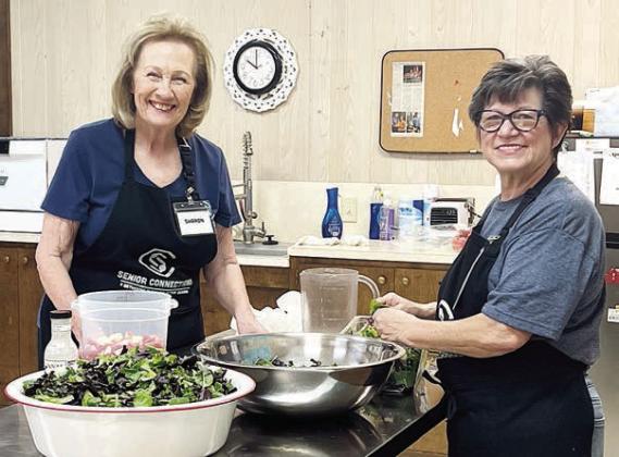 The salad masters are valued volunteers Sharon Rodriguez (left) and Brenda Ray (right). Members love what they create with spinach, seasonal fruits and the “secret sauce”! Everyone is welcome to come try one any time!