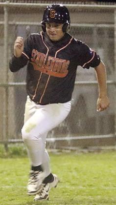 Landon Conner digs for home with the go-ahead run in the bottom of the seventh on March 17. Sticker Photo By Darrell Vyvjala