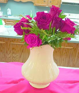 CENTERPIECE was a vase of roses.