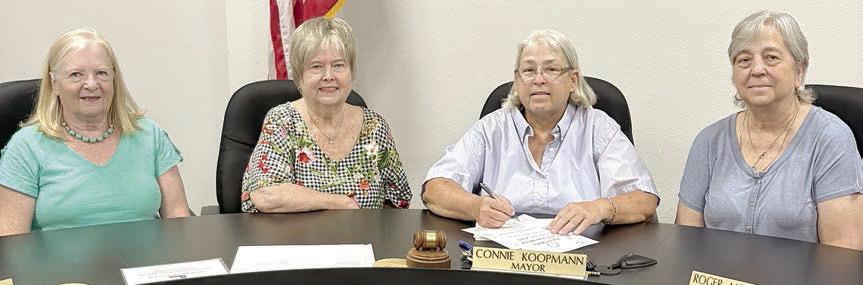 A proclamation designating June 1-7 as National Garden Week in Schulenburg was signed by Mayor Connie Koopmann (second from right), with Schulenburg Garden Club members (from left) Janet Murphy, Bonnie Baker and (right) Debbie Behlen in attendance.