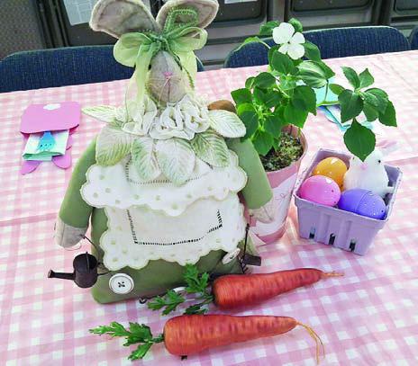 The centerpiece (left) and table decorations (above) carried out an Easter theme.