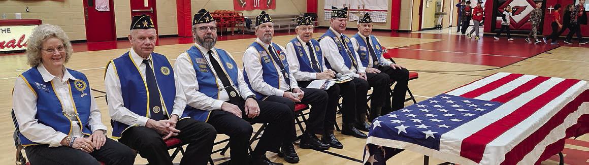 TOP PHOTO – Folding the flag are Legion members (foreground, from left) Vernon Dittrich, Jack Niesner and Ed Semler.
