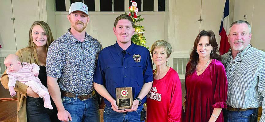 The Schulenburg Volunteer Fire Department’s OUTSTANDING SERVICE AWARD for 2023 went to Dylan Schilhab (center). He made the highest percentage of calls, meetings, and drills at 87 percent. The award is sponsored annually by the family of the late Chief Roland Proske. Making the presentation were: (from right) Jeff, Terry, and Pat Proske, as well as (from left) Kelsey and Doran Proske with their daughter Lace. Sticker Photo By Darrell Vyvjala