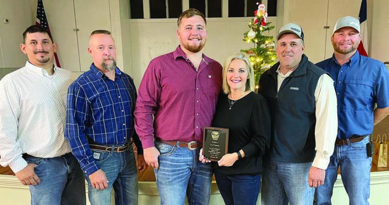 SPECIAL RECOGNITION – Tex Propane, represented by Jaxon and Wendy Fietsam (center), was recognized for its continuing contributions to the Schulenburg Volunteer Fire Department. Presenting the Fietsams with a plaque were (from left) Third Assistant Chief Gary Eudy, Second Assistant Chief Randy Wick; (from right) First Assistant Chief Drew Brossmann, and Chief Darren Guentert. Sticker Photo By Darrell Vyvjala