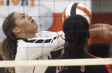 Kieryn Adams gets a dig in the first set against Ganado. Sticker Photo By Darrell Vyvjala