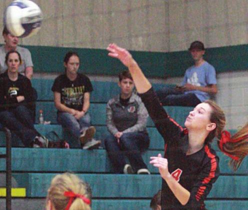 Jordan Sommer gets a kill from the back row in the second set against the Tigerettes. Sticker Photo By Layne Vyvjala