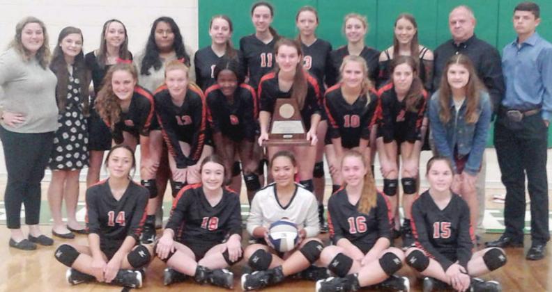 With the 2A Reg. IV runner-up trophy are: (seated, from left) Rilee Sanchez, Keaton Walker, Kieryn Adams, Harly Zapalac, Haylie Goode; (middle, from left) Tamara Otto, Brianna Vavra, Jessalyn Gipson, Jordan Sommer, Megan Ohnheiser, Claire Antosh, mng Landry Zapalac; (back, from left) asst coach Allison Machac, mng Riley Zapalac, mng Presley Sommer, mng Elvia Lara, Mackenzie Kunschick, Meredith Magliolo, Madison Brooks, Kloe Kutac, mng Brooke Redding, head coach Donald Zapalac &amp; mng Blaine Zapalac.