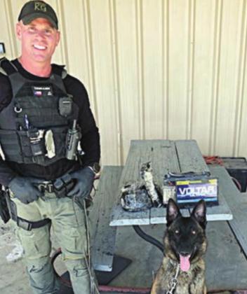 Sgt. Randy Thumann, K-9 Kolt and the heroin with the battery in which it was concealed.