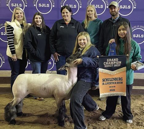 SHEEP – Exhibitor: Olivia Otto (front, left). Sale price: $7,225. Sticker Photo By Darrell Vyvjala