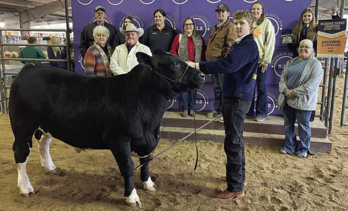 RESERVE CHAMPION MARKET STEER – Exhibitor: Tayt Wenske (front). Sale price: $8,350. Sticker Photo By Darrell Vyvjala