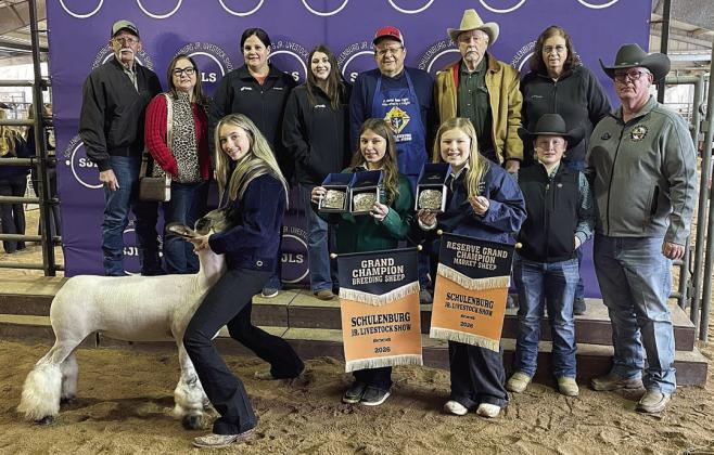 RESERVE CHAMPION MARKET SHEEP – Exhibitor: Kimber Bartosch (front, left). Sale price: $6,500. Sticker Photo By Darrell Vyvjala