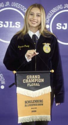 FLORAL CUP – Brennan Chudej, grand champion. Not shown: Lillia Wotipka, reserve champion. Sticker Photo By Darrell Vyvjala