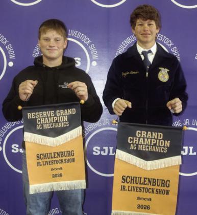 AG MECHANICS SHOW – From left: Cody Beiersdorfer, reserve champion (work table); and Brayden Stoever, grand champion (greenhouse). Sticker Photo By Darrell Vyvjala