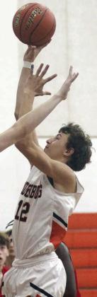 Van Prihoda hits a short jumper in the lane in the first game of the tournament. Sticker Photo By Darrell Vyvjala
