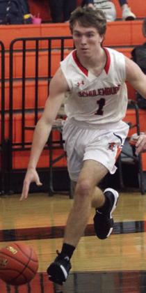 Nick Goode drives to the basket in the first half of Friday morning’s game. Sticker Photo By Darrell Vyvjala