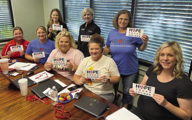 HOPE Squad members include (front row, from left) Callene Zapalac, SISD; Heather Pavlu, sisd; Lindsey Fisbeck, wisd; Misty Mican, wisd; Codi Pesak, wisd; (back row) Cheryl Pekar, Red Door Fund for Mental Health chair; Dr. Jennifer Roberts, Hope Squad southwest regional director who led training for members; Vicki Hudec, wisd; and (not shown) Allison Machac, sisd.