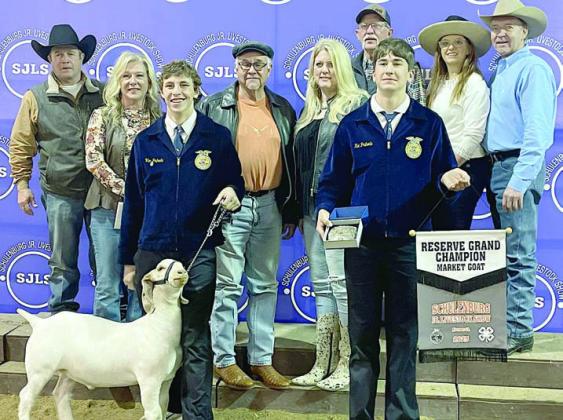 RESERVE CHAMPION MARKET GOAT – Exhibitor: Van Prihoda (front, left). Sales price: $7,200. Sticker Photo By Darrell Vyvjala