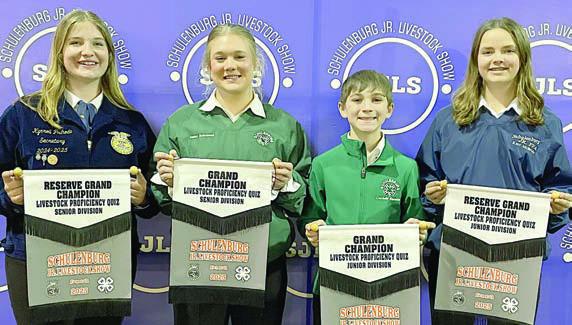 PROFICIENCY TEST – From left: Kyrroll Prihoda, Senior Division reserve champion; Haley Schramek, Senior Division grand champ; Crockett Guenther, Junior Division grand champ; and Kerr McBride, Junior Division reserve champ. Winner scored the best on a test over general livestock knowledge.