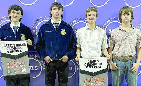 AG MECHANICS SHOW – From left: Colton Knigge and (not shown) Chris Hromadka, reserve champion (10-foot lowboy); Zach Hammack, Adin Beyer, and Cade Ohnheiser, grand champion (cattle chute). Sticker Photo By Darrell Vyvjala Sticker Photo By Darrell Vyvjala