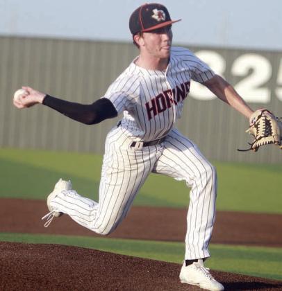 Nick Goode delivers a pitch in game one. Sticker Photo By Darrell Vyvjala