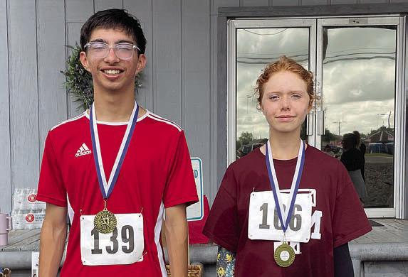 Fastest runners – Keegan Escamilla (left) of Columbus, fastest overall with a time of 18:59, and Judy Ashlynd (right), fastest female with a time of 25:05.