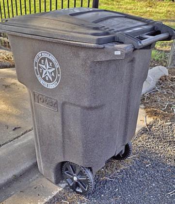 Proper placement of toter – The toter should be on the street in front of the curb with the handle and wheels facing the road.