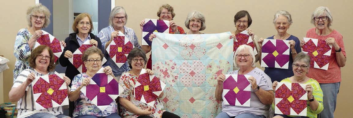 Colorado Valley Quilt Guild members holding the quilt blocks are (front row, from left) Dawn Allison, Kathy Bertsch, Kathi Babcock, Linda Polk, Sandy Courrier, (back row) Janice Raabe, Gay Dobbs, Rachel Mancill, Debbie Huebel, Kathy Theut, Barbara Schellberg, Pat Scherer and Brigitte Mesecke.