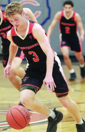 Caden Herzik heads upcourt after a steal in the second quarter. Sticker Photo By Darrell Vyvjala