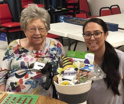 The bingo blackout prize was won by Irene Janda (left) recently. Erica Furnace (right) of Hallettsville Nursing &amp;amp; Rehabilitation Center was the bingo caller and brought this great basket of goodies for the prize.