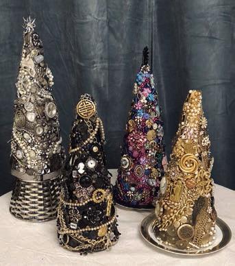 Costume jewelry Christmas trees are being made in the Artful Friday class.