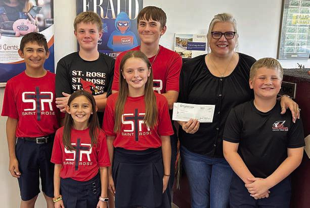 Representing Prosperity Bank is Missy Thomas (back right), shown with St. Rose students (front row, from left) Emma Zweschper, Kynslee Zapalac, Brody Brossmann, (back row) Dylan Zweschper, Bo Brossmann and Kaleb Zapalac.