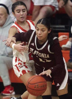Kendra Salmon pressures a Lady Bulldog in the fourth quarter. Sticker Photo By Darrell Vyvjala
