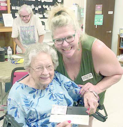 Bingo – Deanie Crim (right) of Schulenburg Family Fitness Center brought some amazing prizes for bingo. Irene Janda (left) won a trip to the nail salon – Ashley Reyna at Hair Expressions in Schulenburg.