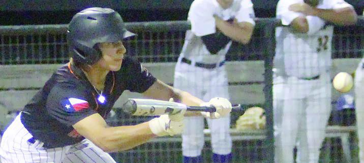 Bryce Stoever bunts to drive in a run last Tuesday. Sticker Photo By Darrell Vyvjala