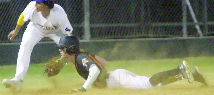 Aaron Janecek slides in safely with a three-RBI triple in Weimar. Sticker Photo By Darrell Vyvjala