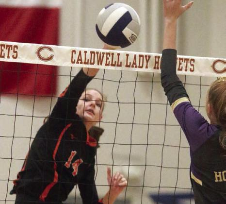 Emmrie Marx sends a kill cross-court in the second set. Sticker Photo By Darrell Vyvjala