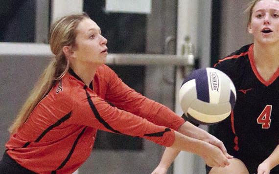 Michaela Kollmann digs a Holland attack in game two. Sticker Photo By Darrell Vyvjala