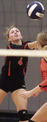 Avery Helms picks up a dig in the third game. Sticker Photo By Darrell Vyvjala