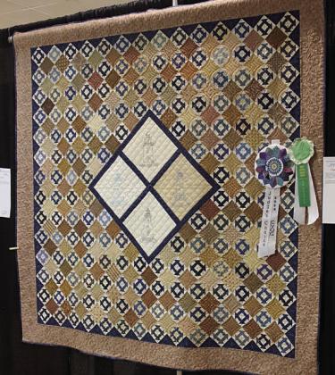 Judges’ Awards – (left) Sandy Courrier’s “Terry’s Choice” and (right) Brenda Winfield’s ‘Light of the World John 8:12”