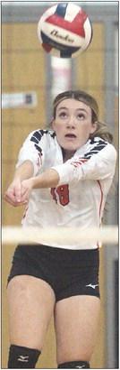 Keaton Walker picks up a dig in the first set versus Waelder. Sticker Photo By Darrell Vyvjala