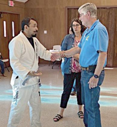 Jesus Martinez (left), jiu-jitsu instructor, demonstrated defensive techniques focusing on what to do when being attacked.