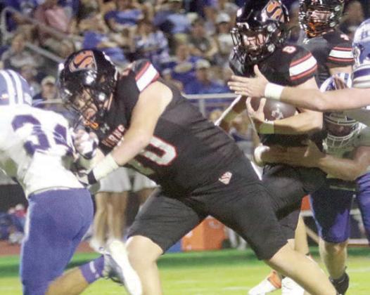 Hayes Baumgarten leads the way for Owen Brenek on a first-quarter run. Sticker Photo By Layne Vyvjala